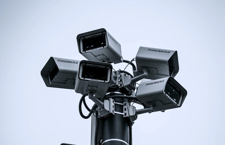 Cluster of surveillance cameras covering a site
